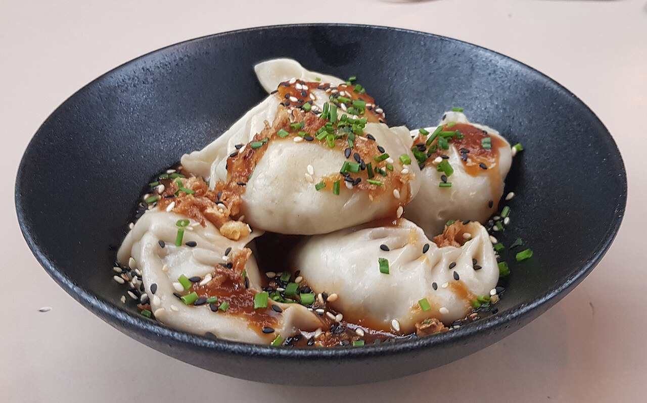 Pork & cabbage dumplings — Illustrative dish photography · credits below